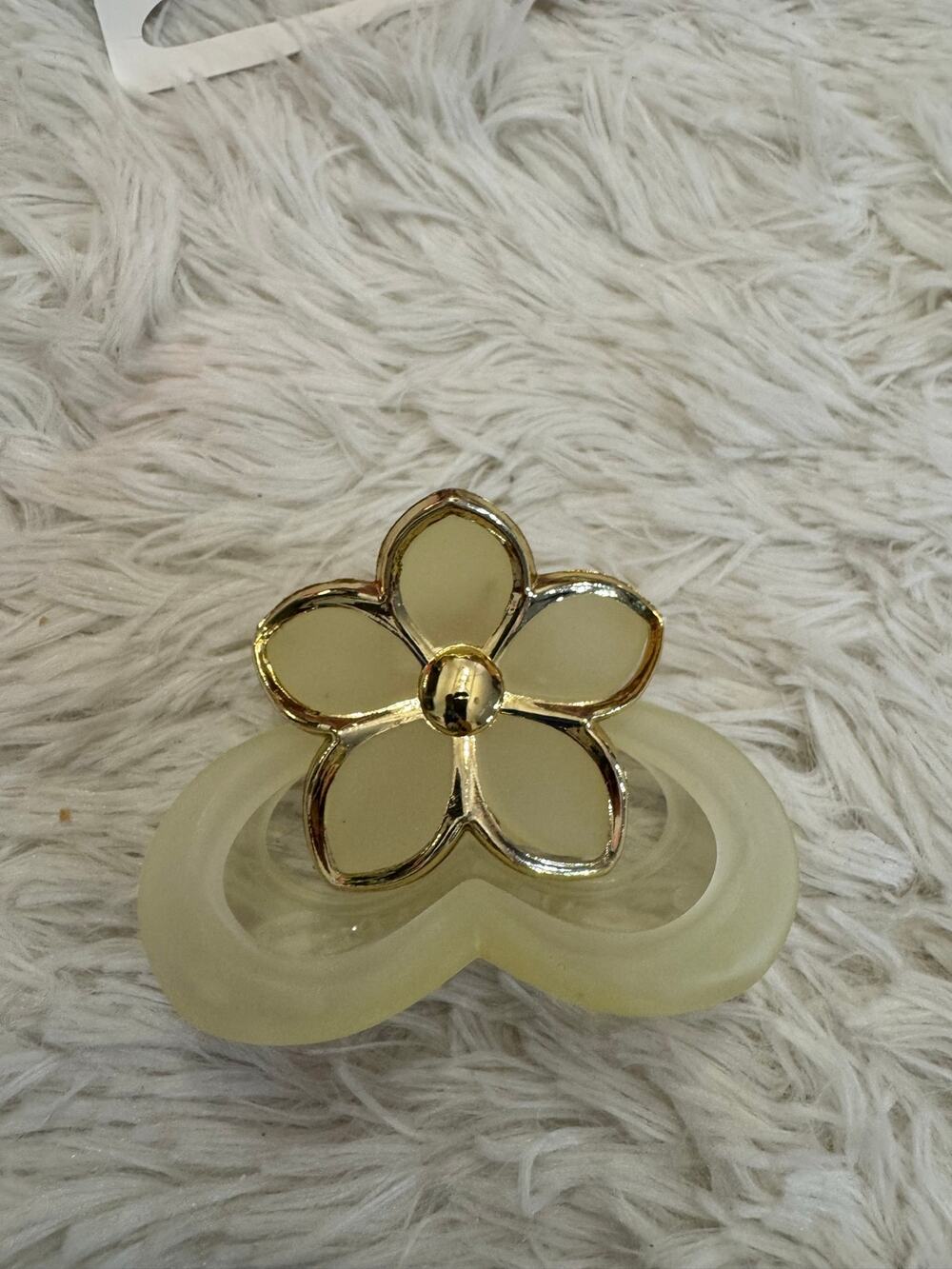Gold and cream flower hair clip with gold flower-shaped embellishment